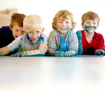 Photo for Children, paint and mess or playing portrait, happy boys in preschool or childhood fun. Educational development, smile and finger or face painting for art, recreation activity for growth together. - Royalty Free Image