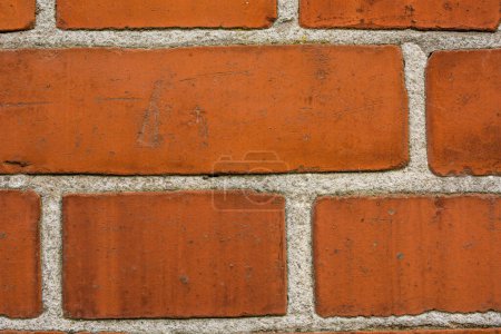 Photo for Building, design and closeup of red, brick wall for texture, background and pattern of exterior structure. Architecture, construction and surface of material, concrete and cement for decoration. - Royalty Free Image