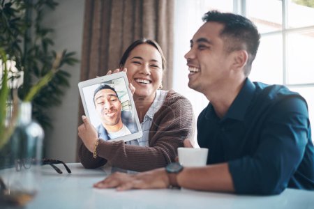 Photo for Couple of friends, video call and tablet screen with people laughing in living room of home together. Face, funny or humor with happy young man and woman in apartment for communication or online chat. - Royalty Free Image