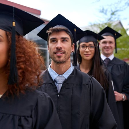 Photo for Education, university and students in row for graduation dreaming and thinking of future. Smile, waiting and group of young people in line for college degree, diploma or certificate by campus - Royalty Free Image