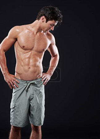 Photo for Man, muscular torso and fitness for exercise or body building for wellness or muscle growth. Male athlete, shirtless and standing with confidence for abs and sixpack on dark background with mockup. - Royalty Free Image