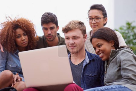 Photo for Group of students, campus and laptop with diversity or International e learning, collaboration or research. Teamwork, studying and people at university and together for diploma, internet or online. - Royalty Free Image
