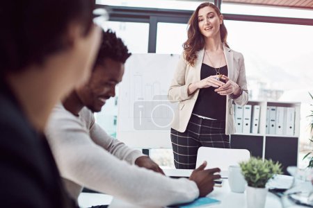 Photo for Boardroom, meeting and woman leader for talk on sales, planning and teaching in training for growth. Female person, chart and graph for feedback and coaching, speaking and ideas to achieve goals. - Royalty Free Image