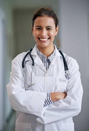 Photo for Woman, doctor with arms crossed with smile in portrait with medical for healthcare in hospital with confidence. Female person, medic and stethoscope for lungs, heart and cardiology for wellness. - Royalty Free Image