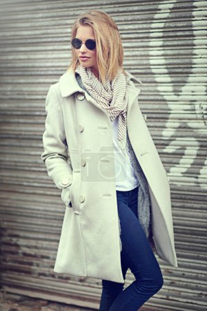 Photo for Fashion, jacket and woman with glasses, city and outdoor in street of New York, road and winter. Cool, female person and stylish, confidence and warm with clothes on wall, pride and elegant as model. - Royalty Free Image