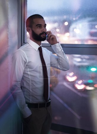 Photo for Phone call, night and businessman in office, city and employee for corporate, company and bookkeeper. Window, dark and male person with network, mobile and technology for talking, working and job. - Royalty Free Image
