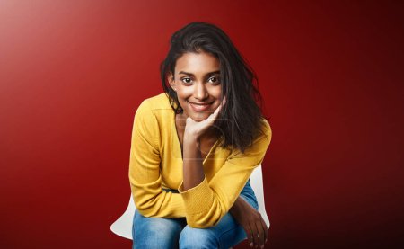 Photo for Recruitment, portrait or Indian girl in waiting room for hr meeting, help or career choice advice on red background. Hiring, internship or student at consultant office for job shadowing opportunity. - Royalty Free Image