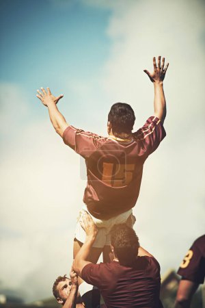 Photo for Rugby player, team and line out jump for competitive sports, tournament or practice on field. Men, athletic and strong outdoor for game training, fitness challenge or playing professional match. - Royalty Free Image