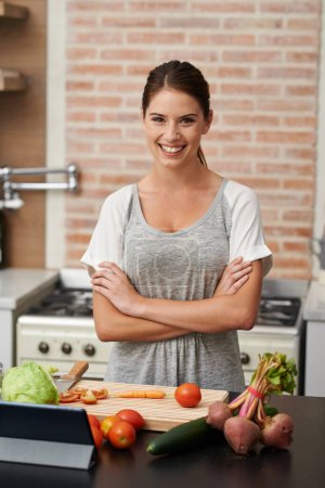 Photo for Nutritionist, woman and arms crossed for meal prep in kitchen with pride for cooking, vegetables and wellness. Happy, salad and healthy in apartment for diet, vegan and recipe in home for cookbook. - Royalty Free Image