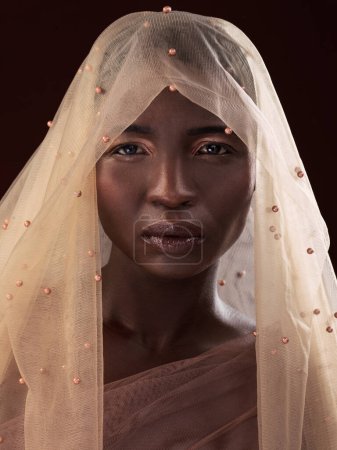 Photo for Portrait, model or black woman with makeup, scarf or confidence in studio on dark background. Beauty glow, face or proud African lady with traditional wrap, eyeshadow cosmetics or creative fashion. - Royalty Free Image