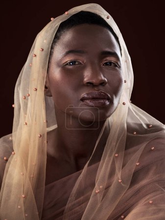 Photo for African, portrait or girl with makeup, scarf or confidence glow in studio on black background. Woman, face or proud model with beauty, eyeshadow cosmetics or traditional fashion in Ghana for culture. - Royalty Free Image