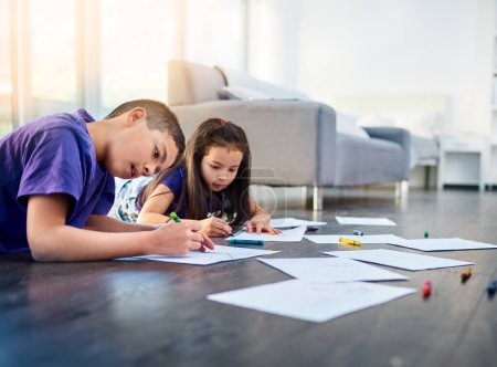 Photo for Floor, play and children with color drawing in home for creativity, relax and fun together. Family, happy siblings and young girl and boy with crayons and paper for childhood, bonding and on weekend. - Royalty Free Image