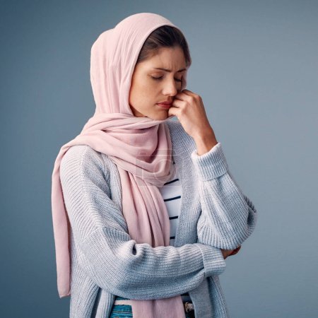 Photo for Muslim woman, sad or stress of anxiety, depression or question of psychology, god or islamic studio. Girl, hijab or upset at thinking, burnout or fear of spiritual, faith or infertility on background. - Royalty Free Image