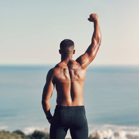 Photo for Win, sports and nature for African man, athlete and mountain for workout, training and exercise. Active, energy and person in environment, muscle and wellness for fitness and healthy for body outdoor. - Royalty Free Image