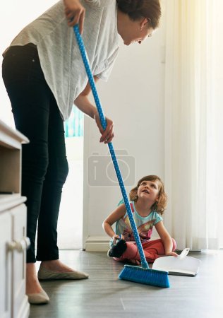 Photo for Broom, sweeping and mom with girl in home for chores, teaching or learning hygiene routine. Housekeeping, mother and daughter cleaning floor together with support, care and child development in house. - Royalty Free Image
