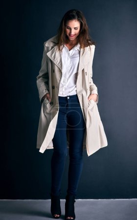 Photo for Fashion, happy and business woman on wall background with trendy clothes, stylish coat and outfit. Office, professional style and person with confidence, pride and smile for career, working and job. - Royalty Free Image