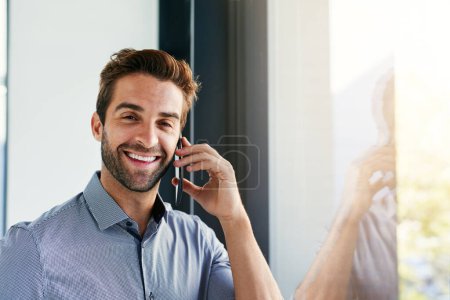 Photo for Man, phone call and business deal in portrait, office and success in negotiation or networking. Male person, window and speaking on app for conversation, consulting and hello for online interview. - Royalty Free Image