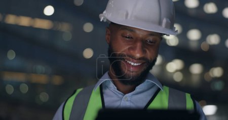 Photo for Black man, tablet and construction engineer at building or night deadline, architecture or project. Male person, hardhat and online search or digital floor plan or renovation, urban or contractor. - Royalty Free Image