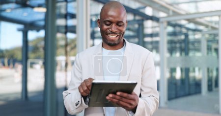 Photo for Black man, tablet and typing in city, commute and online, digital and technology. Working, cape town and busy in urban area, office buildings and businessman for networking and checking email. - Royalty Free Image