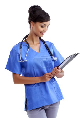 Nurse, woman and documents in studio for healthcare information, results and charts. Medical worker, student or resident physician reading clipboard for clinic training program on white background.
