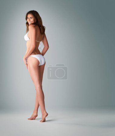 Photo for Woman, portrait and happy with bikini in studio for body positivity, summer fashion and confidence in swimsuit. Model, person and smile in swimwear for holiday, vacation and mockup on gray background. - Royalty Free Image