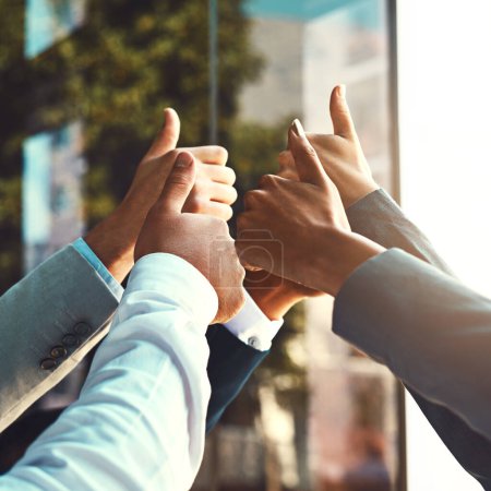 Photo for Diversity, business and hands of group thumbs up in office building for unity with support, trust and yes for collaboration. People, gesture and approval sign for success for partnership and goals - Royalty Free Image
