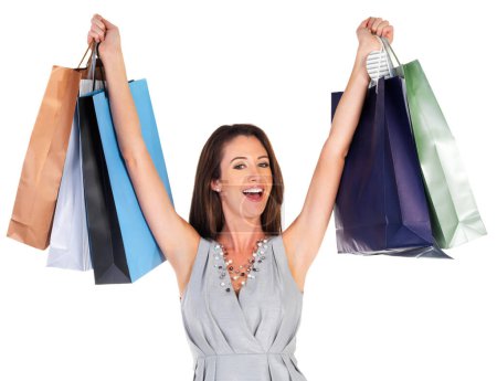 Photo for Excited, shopping bags and portrait of woman with gifts in studio with pride for deal, sale or discount. Happy, paper packet and confident female person with presents isolated by white background - Royalty Free Image