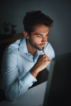 Photo for Hard work, thinking and businessman with pen by computer for email, internet and working late in office for corporate career. Happiness, desk and lawyer with technology for communication in workspace. - Royalty Free Image