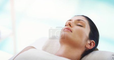 Photo for Salon, beauty and woman relax at spa for massage, facial treatment and luxury pamper. Aesthetic, skincare and person with eyes closed at resort for wellness, cosmetics service and dermatology therapy. - Royalty Free Image