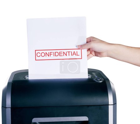 Confidential documents, hand and shredder in studio isolated on white background for privacy. Business, destroy and paper with person using equipment to shred secret information, letter or report.