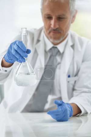 Photo for Mature man, beaker or scientist in lab for science innovation, vaccine or antiaging medicine chemical. Life extension, medical or blur of biologist with chemistry in research or liquid experiment. - Royalty Free Image