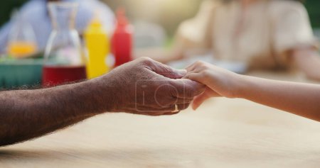 Photo for Holding hands, prayer before eating and gratitude, people worship and religion at social gathering. God, wellness and faith for trust, nutrition and spiritual with support and care at celebration. - Royalty Free Image