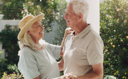Photo for Mature people, man and woman in patio dancing for bonding, romance and love in relationship. Elderly couple, marriage and fun in garden or weekend with smile, happiness and affection with trust. - Royalty Free Image