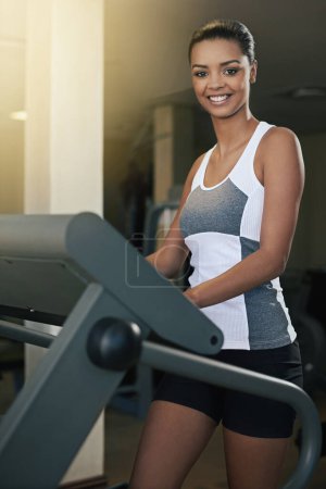 Photo for Black woman, gym and treadmill with smile for workout to exercise and fitness routine for health. Female person, happy and training with commitment for wellness, wellbeing and self care in portrait. - Royalty Free Image