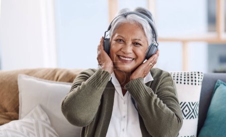 Photo for Portrait, home and old woman with headphones, streaming music and smile with audio and listening to radio. Face, senior person and relax with pensioner and headset with podcast, sound and retirement. - Royalty Free Image
