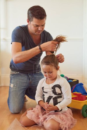 Photo for Tie, home or father with child for hair, support or help to get ready for school or kindergarten. Girl ponytail, prepare or dad with daughter on floor of family house for playing or bonding together. - Royalty Free Image