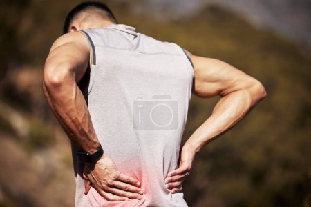 Photo for Man, runner and back pain in nature, ache and hurt outdoors on exercise or workout and accident. Male person, inflammation and fibromyalgia or sciatica issue, spine and strain while hiking or walk. - Royalty Free Image