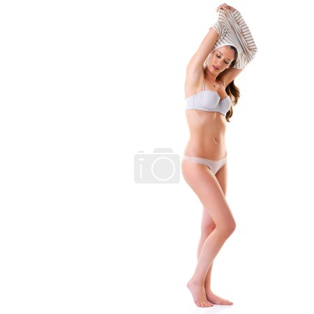 Woman, undress and studio with sweater or underwear for fashion on white background for confidence or conformable. Female person, lingerie and bikini or bra for desire, sexy and isolated with mockup.