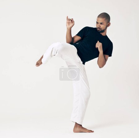 Photo for Martial arts, karate and man with training, workout and fitness on a white studio background. Healthy person, fighter and model with practice and self defense with sports and striking with wellness. - Royalty Free Image