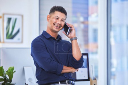 Photo for Business, phone call and man at desk, speaking and connection with entrepreneur, smile and consultant. Person, office and employee with smartphone, contact and mobile user with communication and talk. - Royalty Free Image