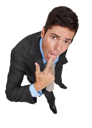 Photo for Portrait, businessman and gesture in disgust with gagging, disapproval and high angle in studio. Male person, professional and finger in mouth in negative, expression and reaction in white background. - Royalty Free Image