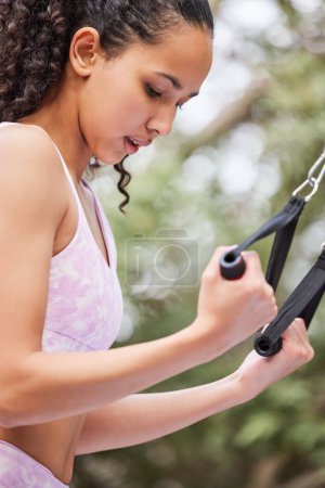 Photo for Fitness, workout and woman at outdoor gym for health, wellness and body care in nature. Exercise, arm muscle training and girl in park to lose weight for challenge in garden, backyard or equipment - Royalty Free Image
