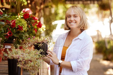 Photo for Woman, portrait and happy for plant shopping outdoor for garden design, agriculture and eco friendly. Customer, face and smile at shop for gardening, sustainability and organic hobby with confidence. - Royalty Free Image