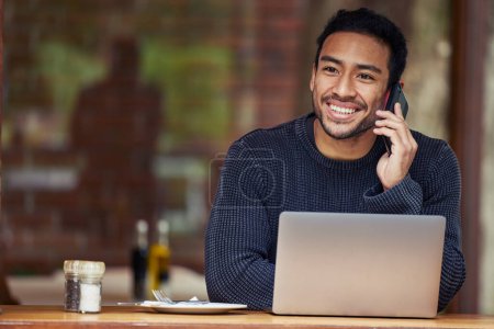 Photo for Man, phone call and laptop in coffee shop for remote work with smile, contact or negotiation with media agency. Writer, computer and smartphone for story, chat or freelance copywriting in cafeteria. - Royalty Free Image