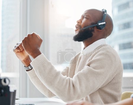 Photo for Celebration, success or black man in call center winning a telemarketing or telecom bonus in office. African consultant, agent or excited virtual assistant with victory, goals or sales achievement. - Royalty Free Image
