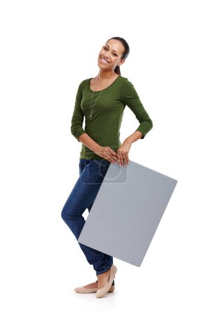 Photo for Woman, smile and board for marketing, advertising and presentation of information for sign and isolated. Young person, portrait and stand with poster for brand, logo or service on white background. - Royalty Free Image