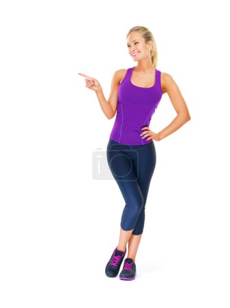 Photo for Fitness, mockup or happy woman with hand pointing in studio for gym, sign up or membership on white background. Exercise, space or lady model show workout revere, feedback or body transformation tips. - Royalty Free Image