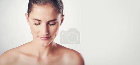 Photo for Woman, skincare and calm in studio for beauty with soft, smooth and clear skin with wellness. Girl, isolated and white background for cosmetics or dermatology, self care and happiness with mockup. - Royalty Free Image