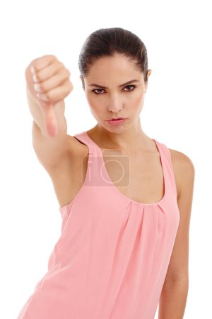 Photo for Woman, portrait and thumbs down for review, feedback or vote with disappointment or wrong on white background. Hand gesture, no way or dislike emoji with opinion, problem or fail sign in studio. - Royalty Free Image