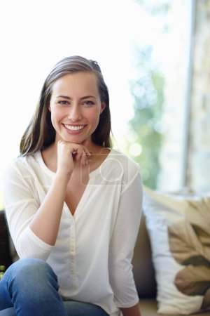 Photo for Woman, portrait and relax on couch for peace, calm and smile for inspiration in living room. Female person, happy and comfortable in lounge on weekend, confidence and pride for ideas or daydream. - Royalty Free Image